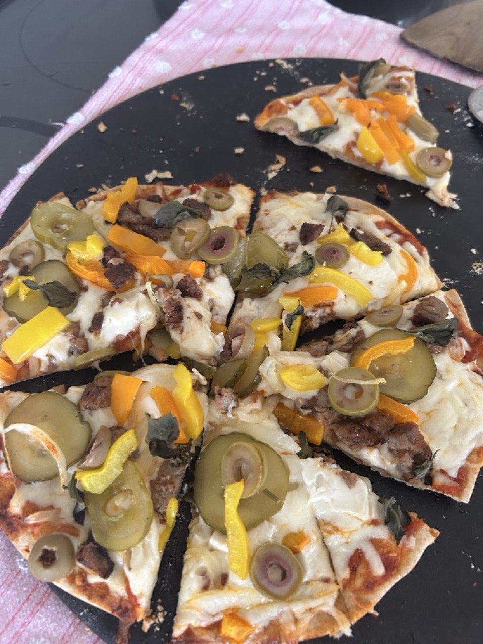 Alt Text: Fresh pita Pizza with favorite toppings.